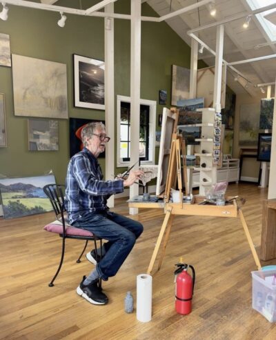 artist painting in his studio