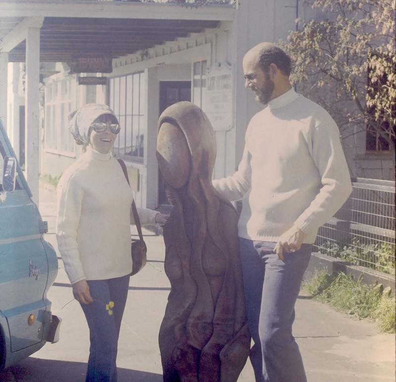 Couple with redwood statue