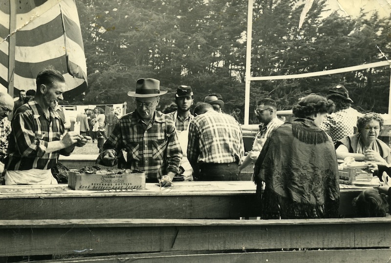 People attending a old-fashioned barbecue