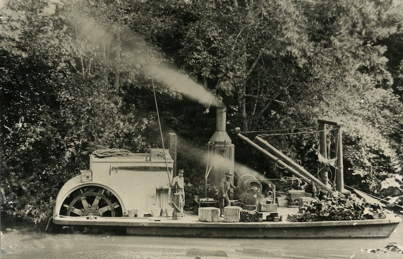 Powered flatboat with paddle wheel