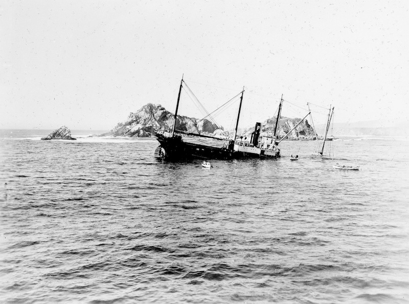 Ship partially submerged in ocean