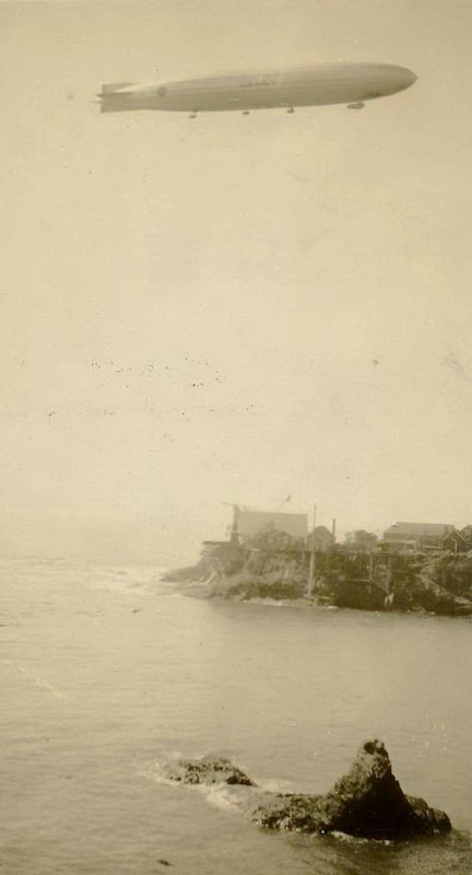 Airship flying over the ocean bluffs